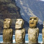 Polynesian moai statues at a beach on Easter Island