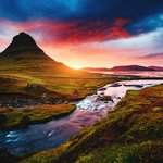 Iceland's Kirkjufellsfoss waterfalls with Kirkjufell in the distance