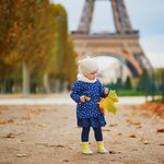 Young child enjoying autumn in Paris