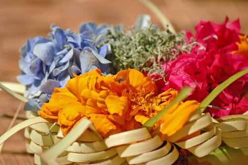 This traditional Balinese offering is known as a "canang sari," created daily by Balinese Hindu women as a form of gratitude to the gods