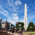 Tourists in front of the obelisk marking the beginning of Argentine Independence in central Buenos Aires