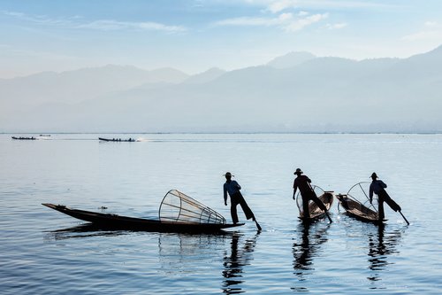 Fisherman on serene Inle Lake