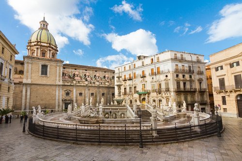 Cool off by Palermo's Fontana Pretoria in Piazza Pretoria