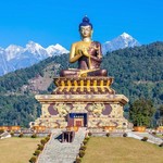 Monastery statue in front of the Himalaya