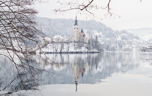 Covered in a veil of snow, Bled Island feels like a place right out of a fairy tale
