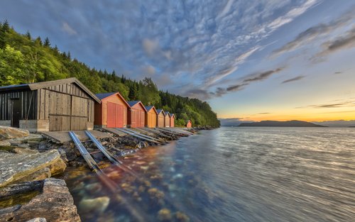Boathouses in a fjord near Ålesund