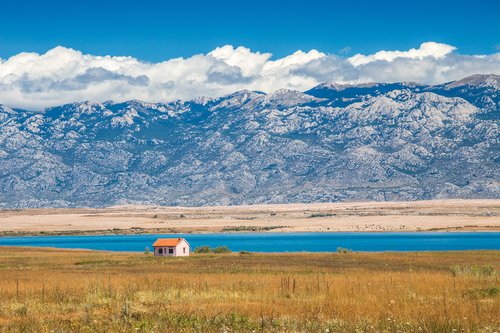 The mountains of Paklenica National Park rise up along the coast near the town of Zadar