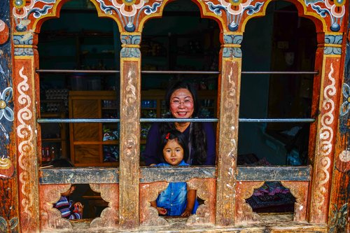Child and mother at a window