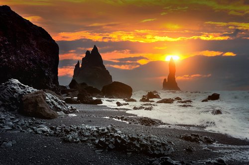 Take in the setting sun from Reynisfjara beach on an early spring afternoon