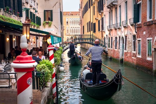 Travel by gondola in Venice's iconic canals