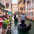 Travel by gondola in Venice's iconic canals