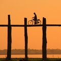 Biking cross the U Bein Bridge