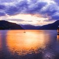 A sunset ferry cruises the Hardangerfjord