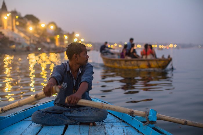 Watch the world go by on a boat trip down the holy river Ganges in Varanasi