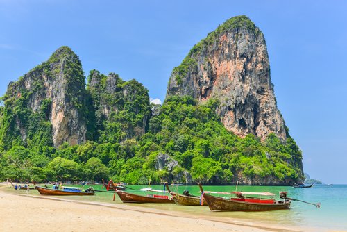 KRABI THAILAND - May 2 2014 : Holidaymakers relaxing on the beach in Rairay Beach Krabi Thailand. Rairay beach is one of famous beach in Krabi. Thailand
