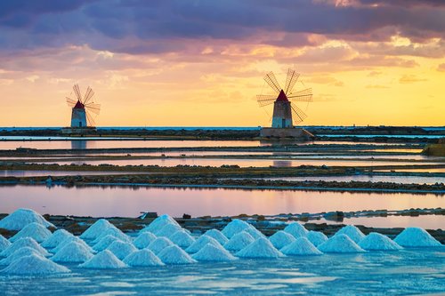 Take in a stellar sunset over windmills and evaporating salt ponds in Trapani