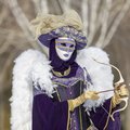 See masked Carnaval revelers in February