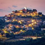 The medieval hilltop town of Motovun lights up at night