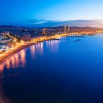 Enjoy an evening stroll along the Barceloneta Beach, Barcelona