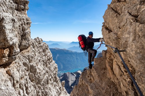 A mountain climber on a via ferrata (iron way) in the Dolomites in Italy