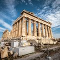 Parthenon on the Acropolis of Athens, Greece. Ancient Greek Parthenon is a top landmark of Athens. Panorama of ruins of the antique Athens city in summer. Famous old architecture in the Athens center.