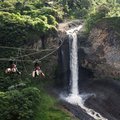 Ziplining toward a waterfall near the town of Baños