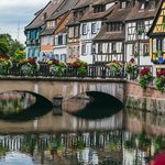Flower lined bridge along the canals of Colmar