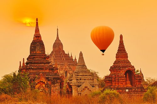 Balloons over Htilominlo Temple at sunrise, Bagan