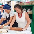 Women rolling dough at a traditional food stand in Rijeka, Croatia