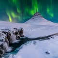 The Northern Lights above snowy Kirkjufellsfoss