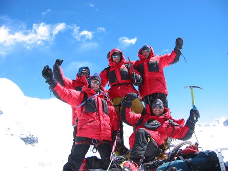 A team of climbers on the summit of Island Peak