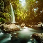 Cool off under waterfalls in the jungle around Tetebatu
