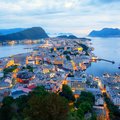 The pretty port city of Ålesund shines at dusk. 