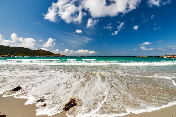 Relax on the white-sand beaches of the Cíes Islands, Spain