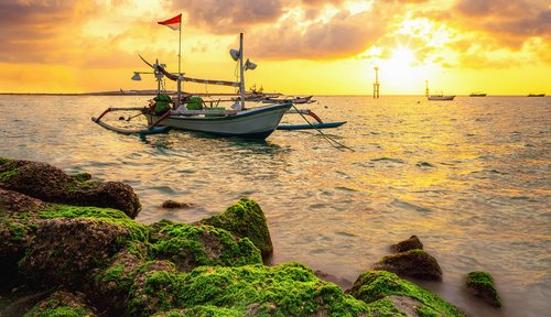 Traditional fishing boats at Sanur beach, Bali, Indonesia