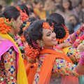 Colorfully dressed dancers performing at a street fair in Kolkata
