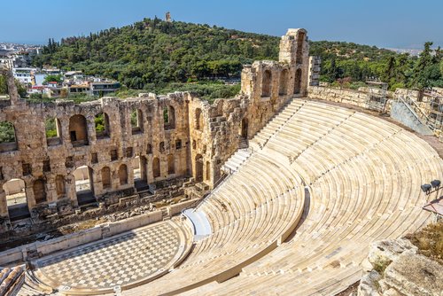 Odeon of Herodes Atticus at Acropolis, Athens, Greece. It is one of the main landmarks of Athens. Antique amphitheater close-up. Scenic view of famous Ancient Greek ruins in the Athens center.