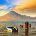 A boat on the azure waters of Lake Atitlan