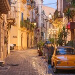 Stroll through the romantic cobbled streets of Syracuse at twilight