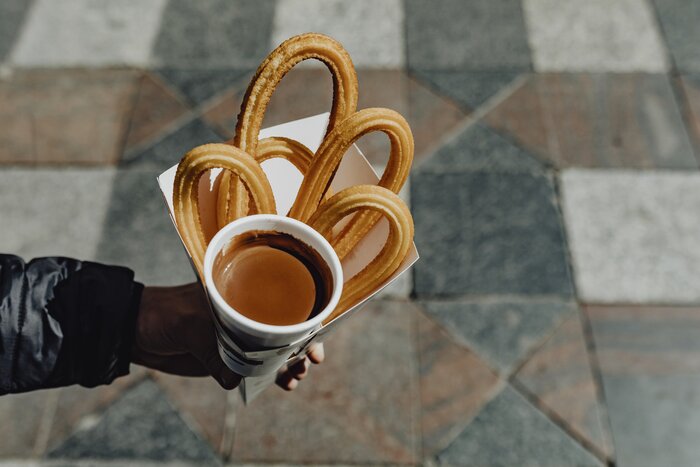 Refuel with treats like churros con chocolate on this food-focused Spanish itinerary