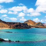 An underwater crater and Pinnacle Rock on Isla Bartolomé