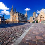 Discover the historic Graslei area and bell tower as you cross the Leie river