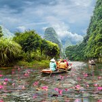 Take to a traditional boat and explore the Ninh Binh Province of North Vietnam