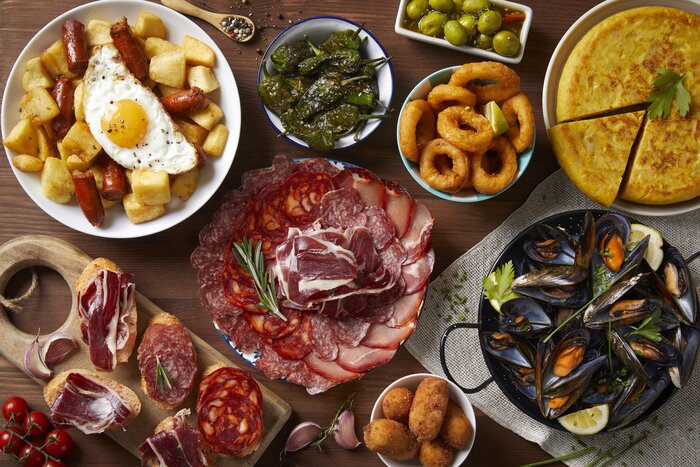 Savor Spanish tapas and local eats on a tour of Barcelona, Valencia, Madrid, and Seville