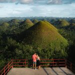 See natural wonders like Bohol's Chocolate Hills as you loop your way through the Philippines from Manila