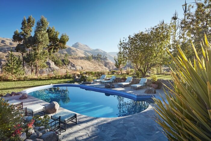 Lounge poolside with views of Colca Canyon on a southern Peru luxury adventure (photo courtesy of Belmond Las Casitas)