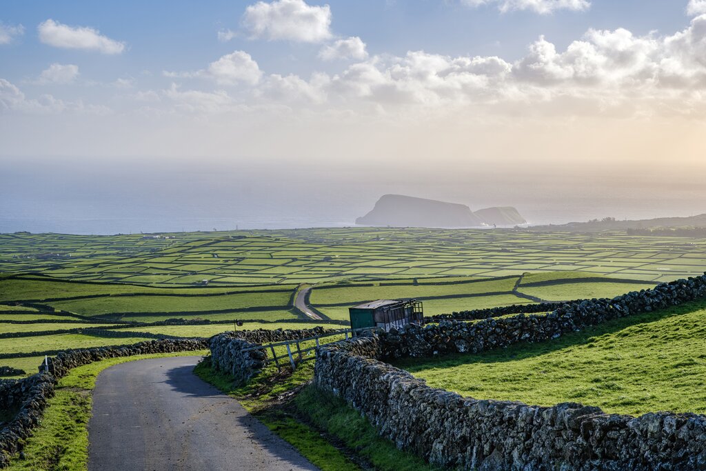 Start your adventure on Terceira, where volcanic rock walls frame the lush farmland