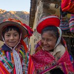Kids in colorful folk costumes in the Pisac Market, Ollantaytambo