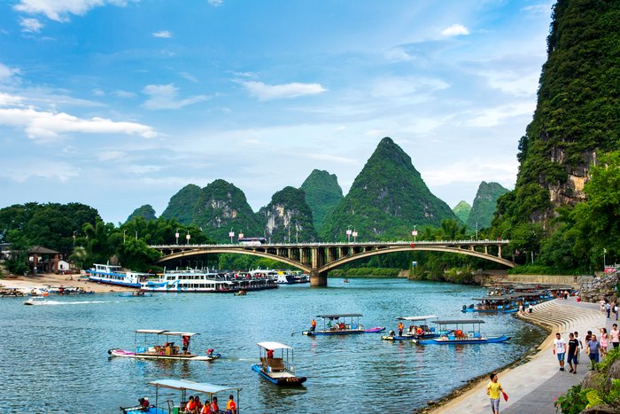 Tourists traveling by bamboo raft on the River Li