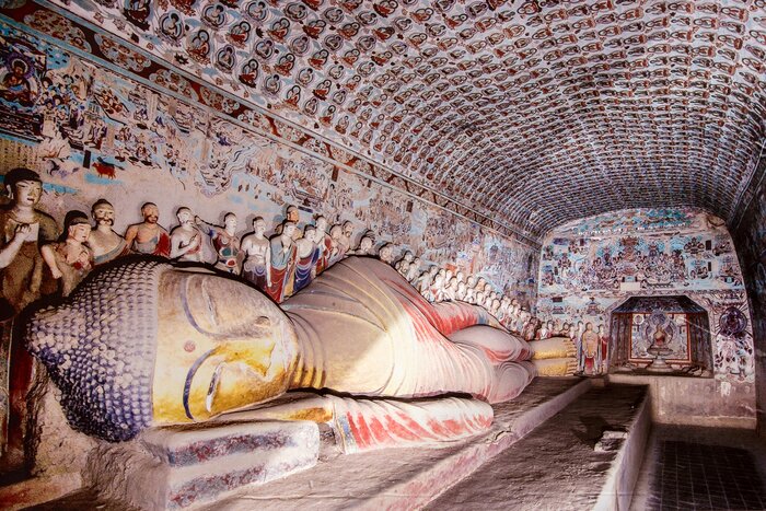 Discover the Buddhist statues and frescoes within  Mogao Caves